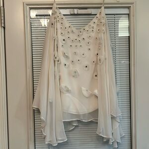 Gorgeous poncho blouse by Badgley miska. I wore with white satin flowy pants.